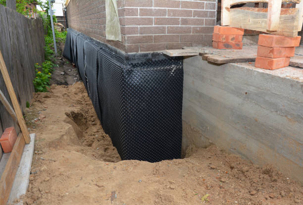 Happy homeowners after waterproofing job in Conover